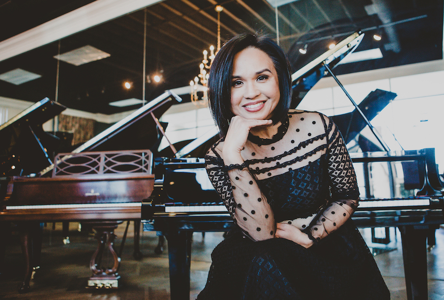Melonie Grinnell in front of piano